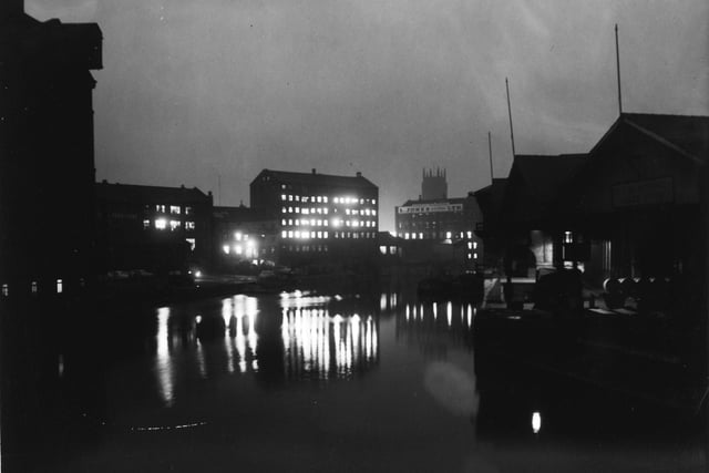 The River Aire by night from Leeds Bridge in November 1960.