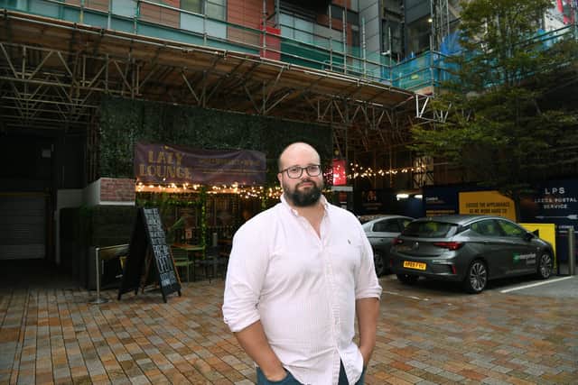 Lazy Lounge owner Tom Bailey has complained about scaffolding costing local businesses a significant amount. Photo: Jonathan Gawthorpe