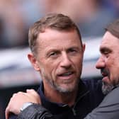 LONDON, ENGLAND - SEPTEMBER 17: Gary Rowett, Manager of Millwall, and Daniel Farke, Manager of Leeds United, embrace prior to the Sky Bet Championship match between Millwall and Leeds United at The Den on September 17, 2023 in London, England. (Photo by Alex Pantling/Getty Images)