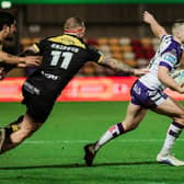 Max Jowitt  is tackled by Josh Griffin during Wakefield Trinity's win at York Knights. Picture by Alex Whitehead/SWpix.com.