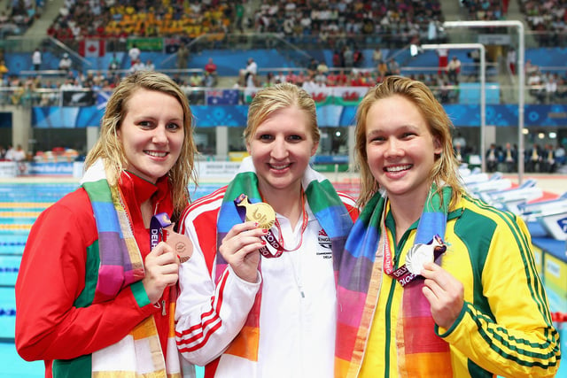 Medalists Jazmin Carlin of Wales (Bronze), Rebecca Adlington of England (Gold) and Kylie Palmer of Australia (Silver) pose during the medal ceremony for the Women's 400m Freestyle Final during day five of the Delhi 2010 Commonwealth Games in 2010.