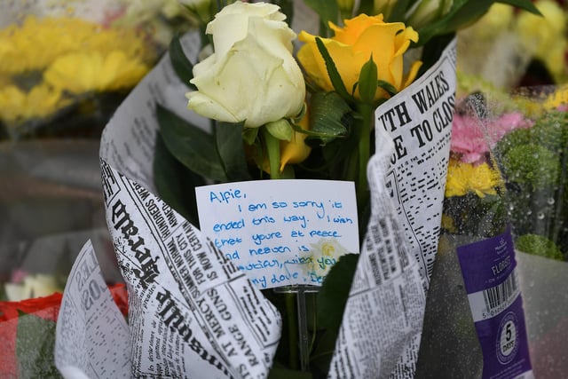 Flowers have been left near to the scene of the crime, along with notes like this one that reads: "I am so sorry it ended this way. I wish that you are at peace and heaven is beautiful."