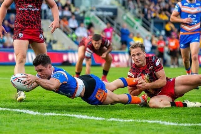 Brodie Croft stretches over to score the first of his two tries for Leeds Rhinos in their win over Leigh Leopards. Picture by Bruce Rollinson.