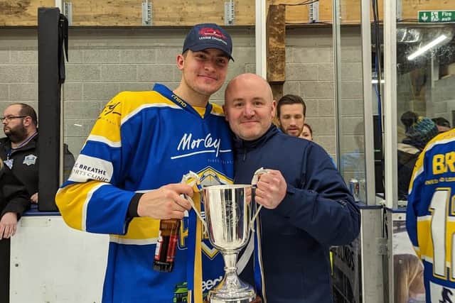 WINNERS: Cole Shudra and Leeds Knights head coach Ryan Aldridge celebrate with the trophy at Elland Road Ice Arena on Sunday night