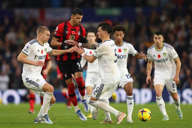 LEEDS, ENGLAND - NOVEMBER 05: Dominic Solanke of AFC Bournemouth battles for possession with Rasmus Kristensen and Robin Koch of Leeds United during the Premier League match between Leeds United and AFC Bournemouth at Elland Road on November 05, 2022 in Leeds, England. (Photo by Marc Atkins/Getty Images)