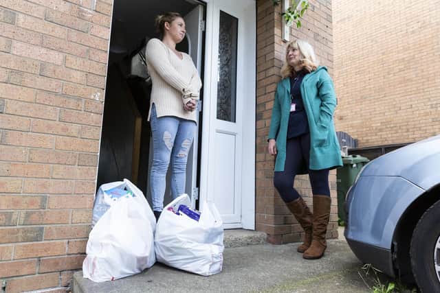 Wrenthorpe Kirkhamgate Assist food bank founder Nic Standby, 54, delivers food to single mum-of-two Beth. Picture: Lee Mclean/SWNS.