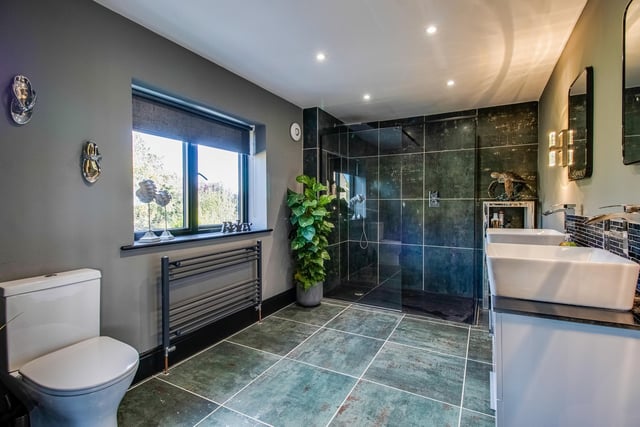 Twin wash basins and a double walk-in shower feature in this contemporary style facility.
