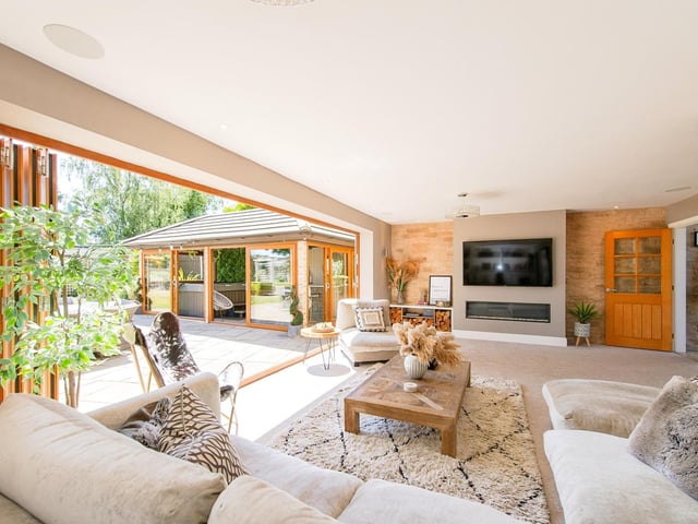 Bi-fold doors open to the rear garden from the spacious lounge.