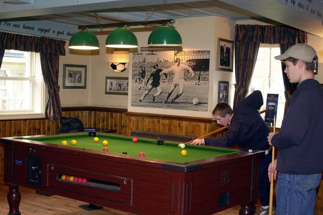 An interior picture showing the Leeds United-themed Shamrock pub in Pudsey.