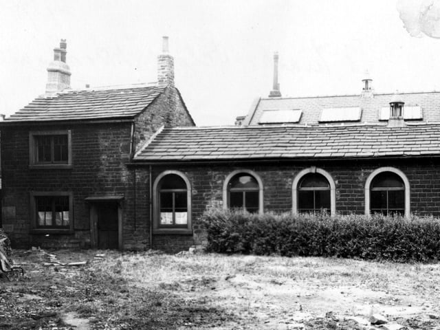 St Mark's National School on Raglan Road in a state of disrepair prior to demolition in August 1950. Rubble is on the grassy area in the foreground and a hedge is in front of the school.