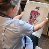 Carer from Horsforth Manor admires work by Aritst - Agni Krivanos