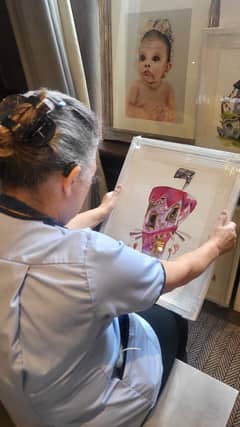 Carer from Horsforth Manor admires work by Aritst - Agni Krivanos