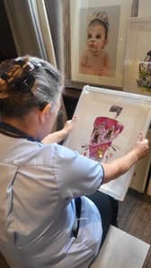 Carer from Horsforth Manor admires work by Aritst - Agni Krivanos