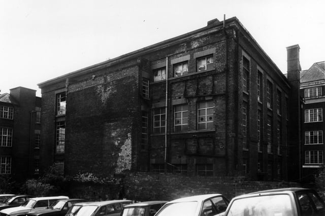 The rear of Templar House seen from the car park at the back in June 1984. This grade II listed building is situated at the corner of Templar Lane, background left, and Lady Lane, background right. It was originally built as a Methodist Chapel but is here occupied by British Road Services. Its condition is already seen to be deteriorating and it has since deteriorated further as a result of being left vacant for some time.