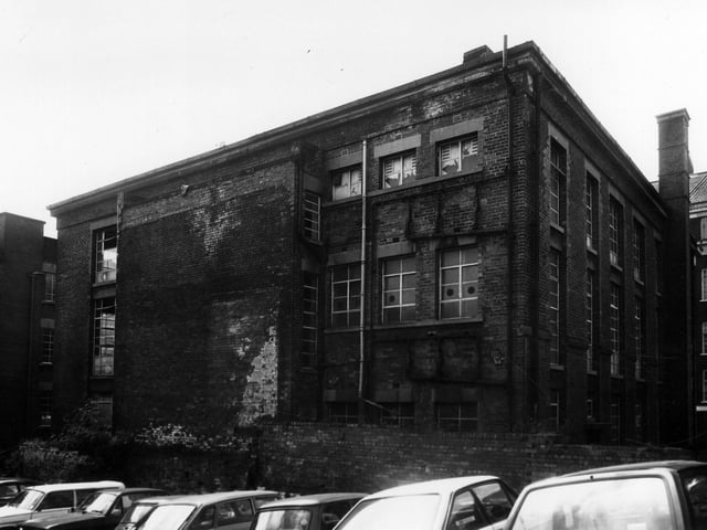 The rear of Templar House seen from the car park at the back in June 1984. This grade II listed building is situated at the corner of Templar Lane, background left, and Lady Lane, background right. It was originally built as a Methodist Chapel but is here occupied by British Road Services. Its condition is already seen to be deteriorating and it has since deteriorated further as a result of being left vacant for some time.
