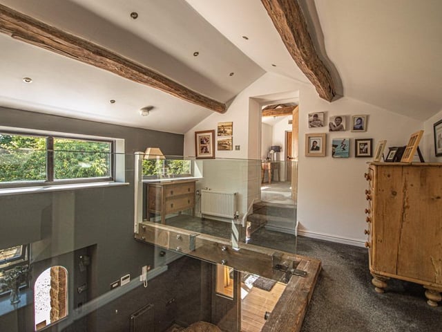 A glass balustrade allows downward viewing from the landing.