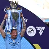 Despite featuring infrequently for the Premier League champions, Kalvin Phillips has achieved the goal of getting his hands on silverware since his £42m switch last summer. Look at that grin. (Photo by OLI SCARFF/AFP via Getty Images)