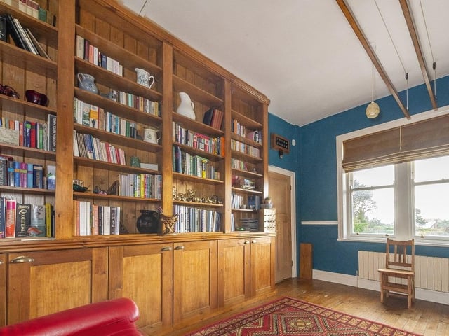 Sitting off the breakfast kitchen is a beautiful room which has been enjoyed as a library and study.