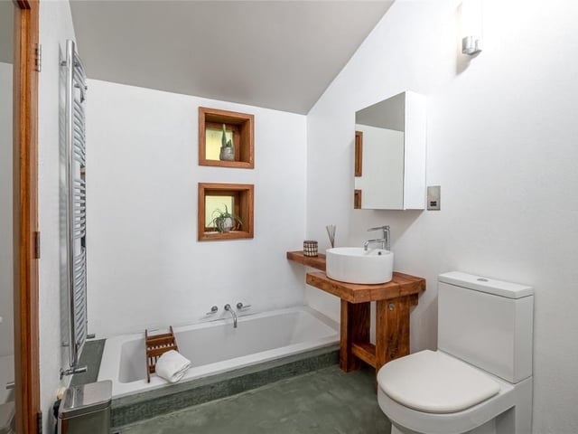 There are three further bedrooms, all of which offer generous proportions and are serviced by their own recently appointed en-suite wet rooms.