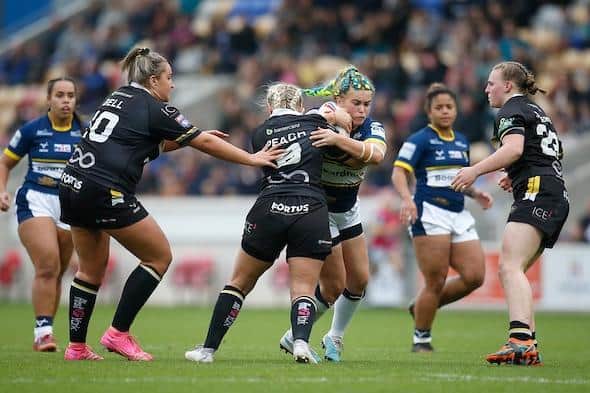 Beth Lockwood in action for Leeds Rhinos during last year's Super League Grand Final defeat by York Valkyrie. Picture by Ed Sykes/SWpix.com.