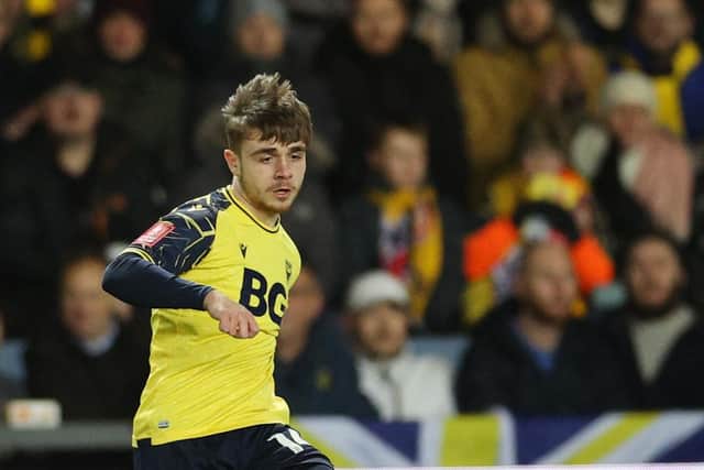 Oxford United's English midfielder Lewis Bate passes the ball to Oxford United's English midfielder Cameron Brannagan during the FA Cup third round football match between Oxford United and Arsenal. (Photo by ADRIAN DENNIS/AFP via Getty Images)