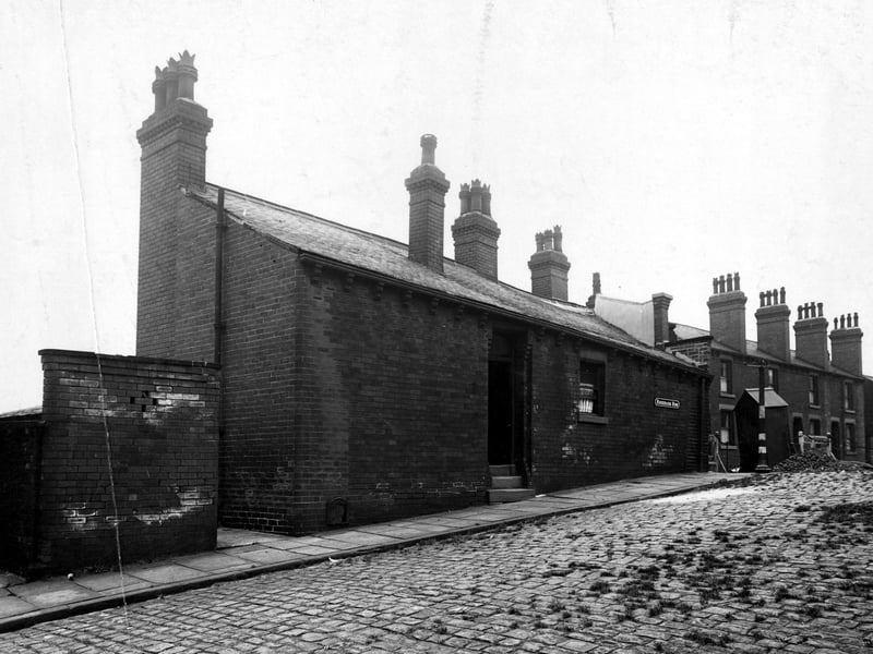 A view looking north at number 1 Rosebank Row onto Rosebank Road. "Road stopped" sign and a workman's hut in the background. Pictured in August 1944.