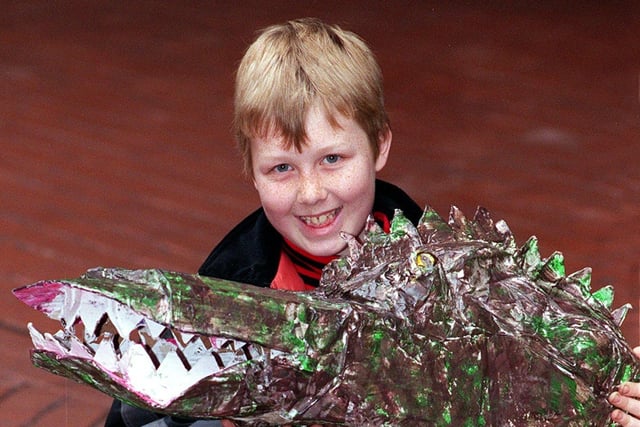 This is Richard O'Brien, a pupil Richmond Hill Primary, with his winning dinosaur mask in the Royal Armouries dinosaur competition. Pictured in March 1998.