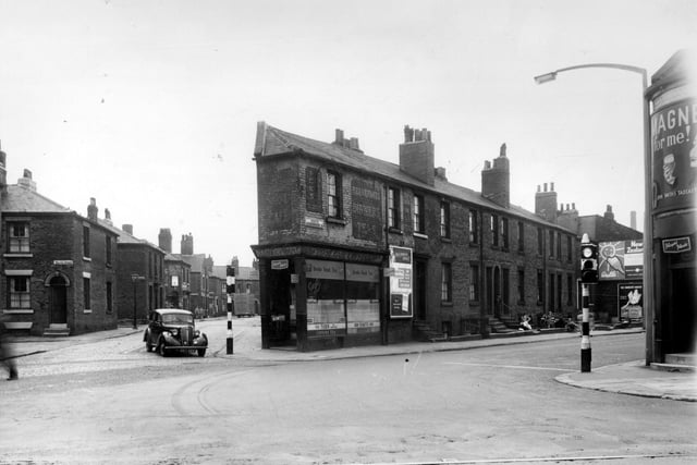 In the foreground of this view Hunslet Road runs from left to right, tramlines are visible. On the left, a car waits to turn out of Holdsworth Street. South Accomodation Road. This cafe offered breakfasts dinners and teas. Pictured in August 1958.
