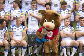 Little fan Elsie Payne, aged five, gives Children’s Heart Surgery Fund mascot Katie Bear a cuddle during Leeds Rhinos' photocall at AMT Headingley. Picture by Simon Hulme