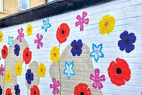 A mural has been painted at the new Little Leeds cafe, with plans for regular customers to feature in the design.