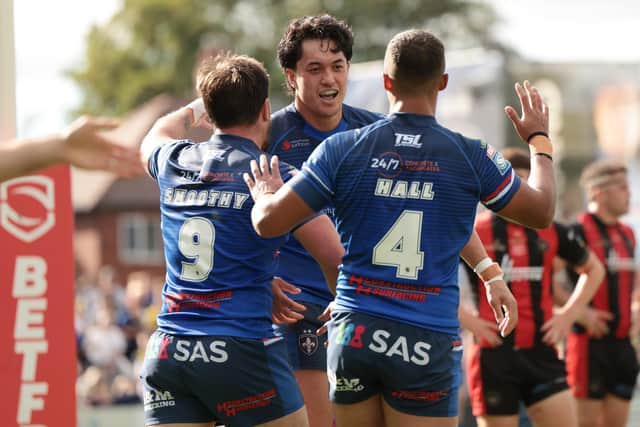 Isaiah Vagana celebrates scoring in last week's Super League defeat of Warrinbgton Wolves, a result which keeps Wakefield Trinity in the hunt for third place. Picture by John Clifton/SWpix.com.