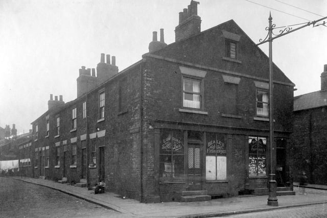 Society Street which was off Low Road pictured in August 1929. On corner is Beales Fisheries with John Robert watson, Greengrocers next door at number 44 on junction with Jericho Street.