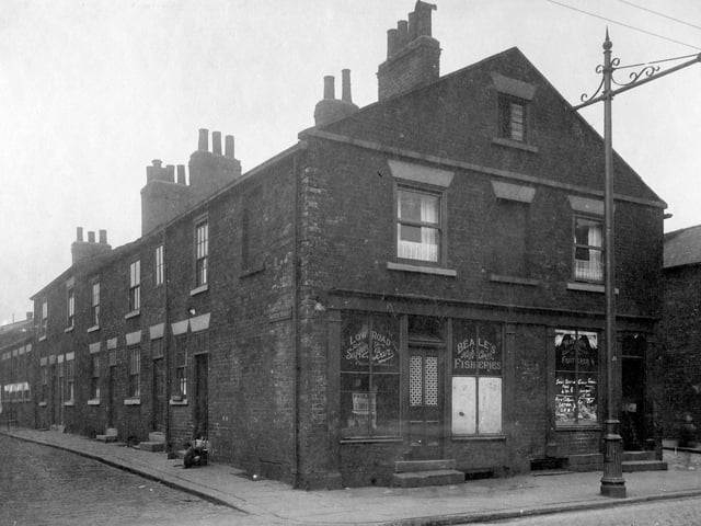 Society Street which was off Low Road pictured in August 1929. On corner is Beales Fisheries with John Robert watson, Greengrocers next door at number 44 on junction with Jericho Street.