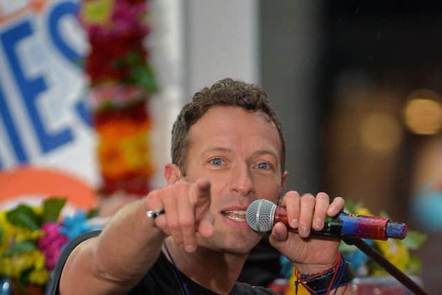 IMPRONTU act:  Chris Martin sang for engaged couple. Photo: Getty Images