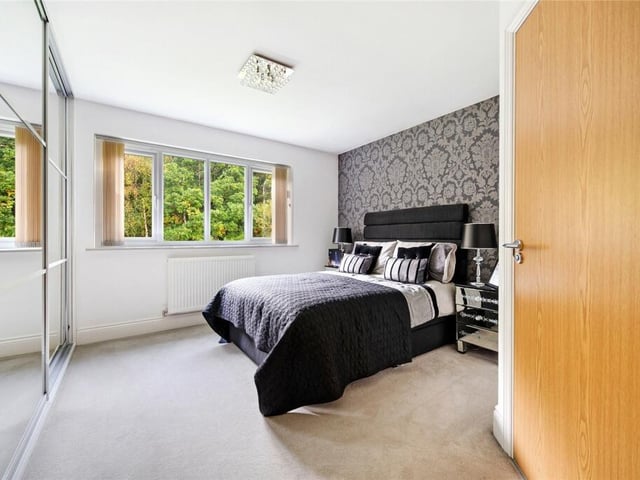 Upstairs are five generously sized bedrooms, two of which have en suites.