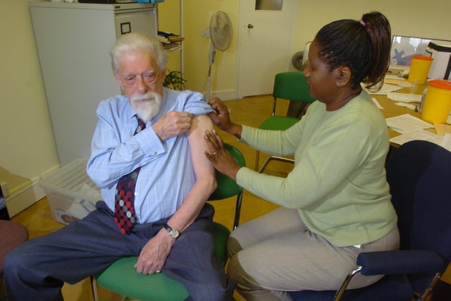 The launch of a flu jab campaign at Carers Leeds, in Leeds city centre. Pictured is the Earl of Harewood receiving a vaccine from clinical lead nurse Gladys Ngenda on October 1, 2004.