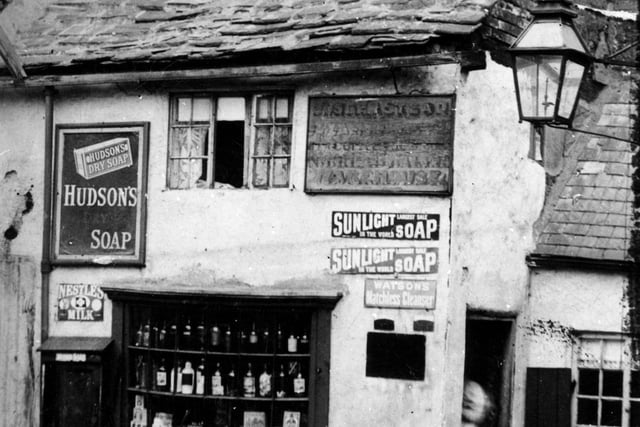 A bit of old Holbeck in Towngate in August 1898. Shop premises with adverts on the wall for Hudson's soap, Sunlight soap, Watson's matchless cleanser and Nestles milk.