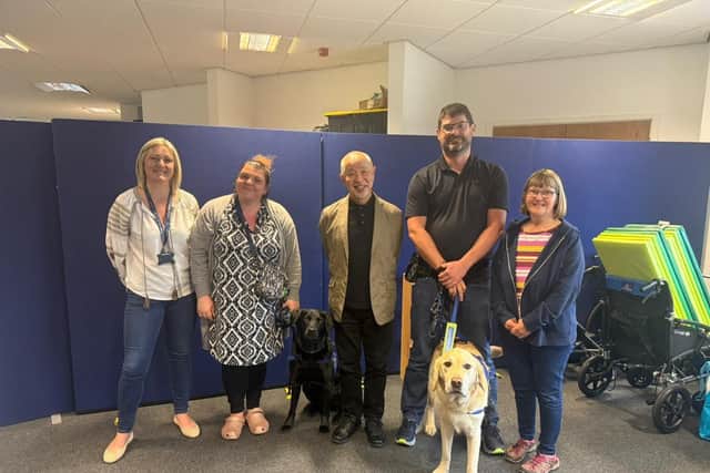 Sam Tawada, of Japan Guide Dog Association (centre), with (from left) Katie Burns, Support Dogs' training manager, Support Dogs clients Vicki Whitbread and Paul Fletcher with support dogs Ivanhoe and Marky and Helen Freeman from Guide Dogs