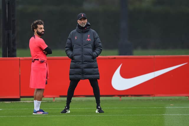 TROUBLE: Predicted by the YEP Jury as Leeds United get set to face Liverpool star Mo Salah, left, under Reds boss Jurgen Klopp, centre.
Photo by John Powell/Liverpool FC via Getty Images.
