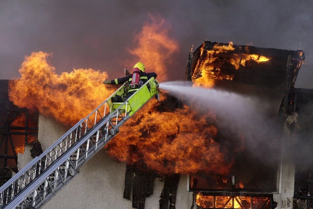 Firefighters tackle a major blaze at Crawshaw High School in July 2001.