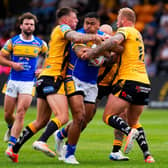 Castleford Tigers' Alex Mellor, left and Joe Westerman tackle Sam Lisone of Leeds Rhinos. Picture by Olly Hassell/SWpix.com.