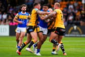 Castleford Tigers' Alex Mellor, left and Joe Westerman tackle Sam Lisone of Leeds Rhinos. Picture by Olly Hassell/SWpix.com.