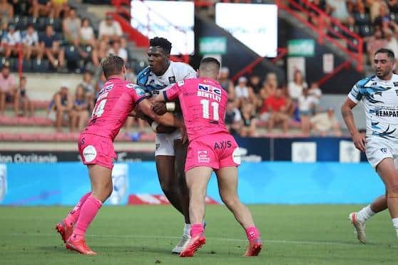 Toulouse prop Justin Sangare, pictured being tackled by Leeds' Brad Dwyer and James Bentley, will join Rhinos in pre-season. Picture by Manuel Blondeau/SWpix.com.