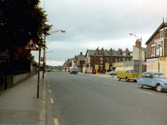 July 1981 and in focus is Roundhay Road looking north-east during a time of riots in the area. All the shop fronts are boarded up for protection including that of Halina Travel Burueau on the right. Further along, a garage situated between Lascelles Street and Back Lascelles Terrace is also boarded up.