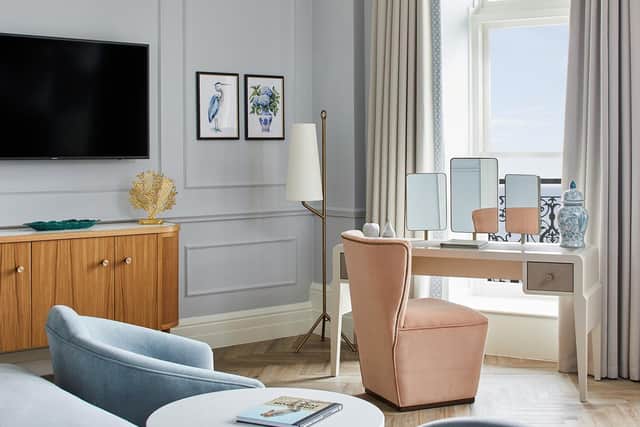 The beautiful bedroom boasts a wall-mounted flat screen TV.