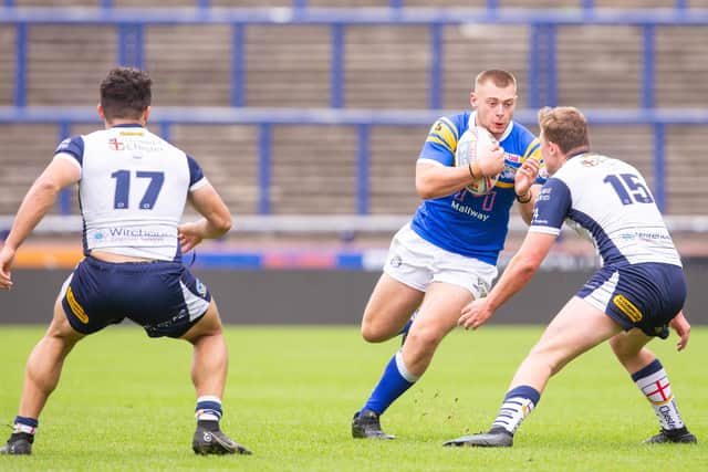 Jake Higgins on the charge for Rhinos' academy against Warrington. Picture by Craig Hawkhead Photography/Leeds Rhinos.