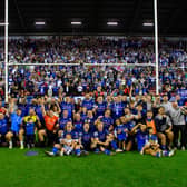 Wakefield Trinity players, staff and families pose for a team picture in front of their fans following last weekend's semi-final win at Wigan Warriors. Picture by Allan McKenzie/SWpix.com.