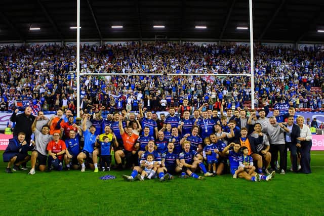 Wakefield Trinity players, staff and families pose for a team picture in front of their fans following last weekend's semi-final win at Wigan Warriors. Picture by Allan McKenzie/SWpix.com.