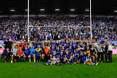 Wakefield Trinity players, staff and families pose for a team picture in front of their fans following last weekend's semi-final win at Wigan Warriors. Picture by Allan McKenzie/SWpix.com.