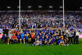 Wakefield Trinity players, staff and families pose for a team picture in front of their fans following last weekend's semi-final win at Wigan Warriors. Picture by Allan McKenzie/SWpix.com.
